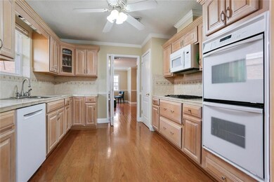 Kitchen features double oven and gas stove