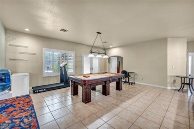 Playroom with arched walkways, light tile patterne
