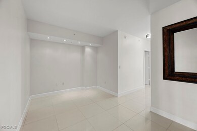 Spare room with light tile patterned floors and recessed lighting