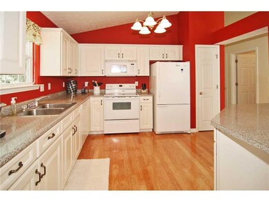 Kitchen. Kitchen has gleaming hardwood floors and all appliances stay.