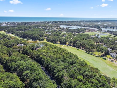 Aerial view of a large body of water and a golf course