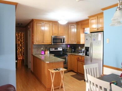 Oak cabinets and eating bar area.