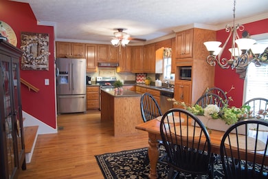 Kitchen features hard surface counters, stainless appliances, pantry and laundry room