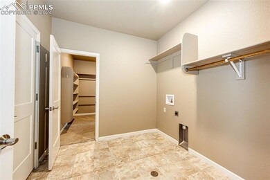 Laundry area with washer hookup and hookup for an 