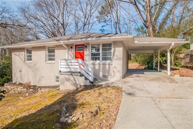 View of front facade featuring a carport