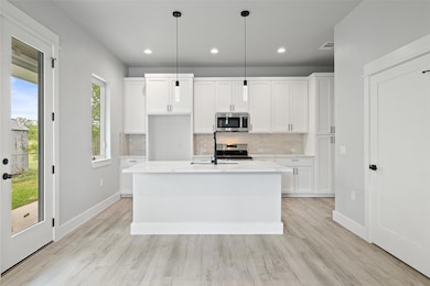 Kitchen featuring appliances with stainless steel