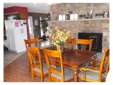 Dining Room. Double sided woodburning fireplace.