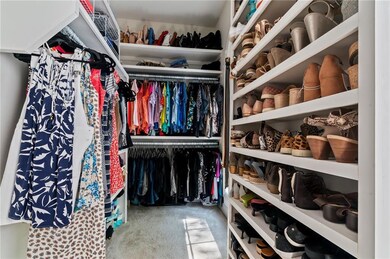 Primary closet with tons of storage