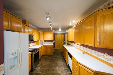 Kitchen looking to laundry room
