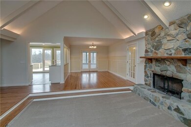 The Living Room also has a cozy Wood Burning Fireplace. 
