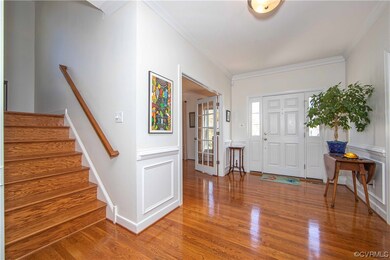 Hardwood floors in this extra wide foyer along wit