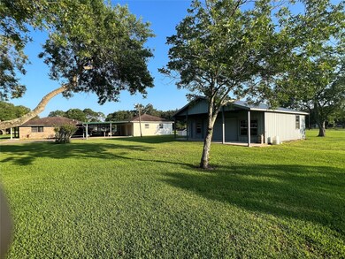 Front view of the garage and barn