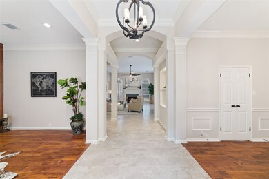 Spacious and elegant hallway with high ceilings. T
