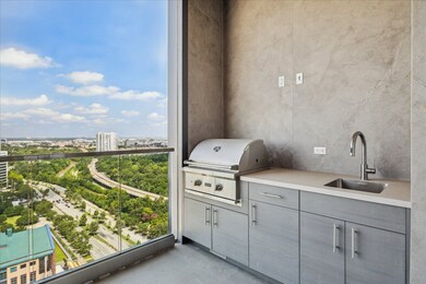 Featured covered balcony and summer kitchen.