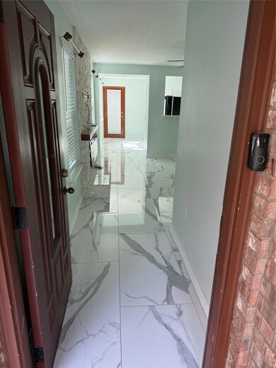 Bathroom featuring marble finish floors