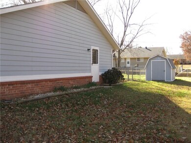 Side door off of garage.  Storage shed conveys.