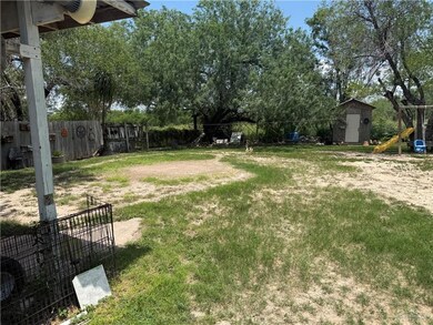 View of yard featuring a shed