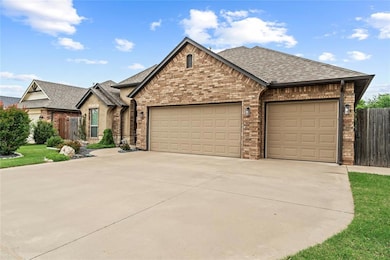 French provincial home with brick siding, driveway, a garage, and roof with shingles
