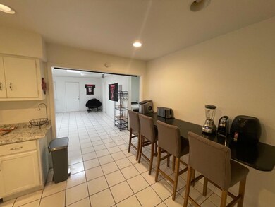 Kitchen/breakfast bar used as small appliance area