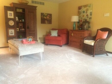 Formal living room with new carpet & tastefully decor