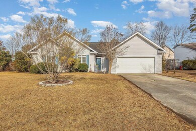 View of front of house featuring a garage and a fr