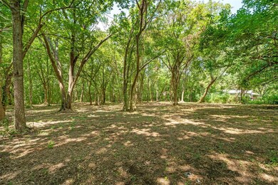 View of yard with a wooded view