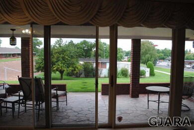 view from living room to back patio with stamped c