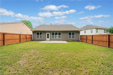Rear view of house with a patio area