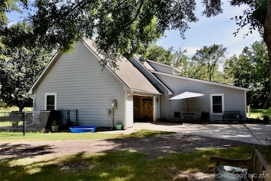 2 car garage behind the house with kitchen entrance