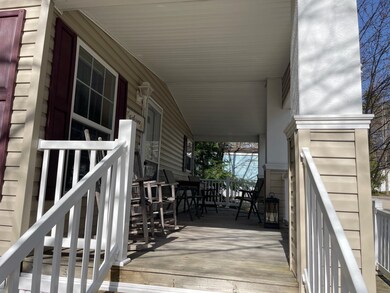 ENTER UP THE STEPS ONTO THE EXTRA LARGE FRONT PORCH