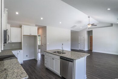 Kitchen featuring a kitchen island with sink, sink