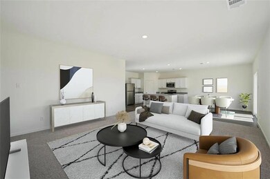 Living room featuring recessed lighting and light colored carpet