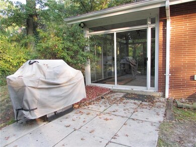 Outside the sun room is a Concrete Stone Patio, wh
