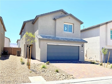 View of front facade featuring an attached garage,