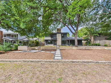 Mid-century inspired home with a patio and a chim