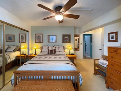 Primary bedroom with mirrored closet to the left a