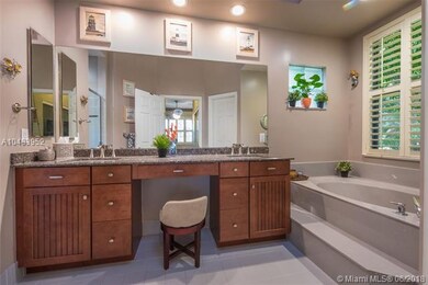 Remodeled master bathroom has sunken Roman tub and