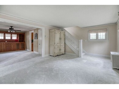 Living room is bright a and features new carpet!nd