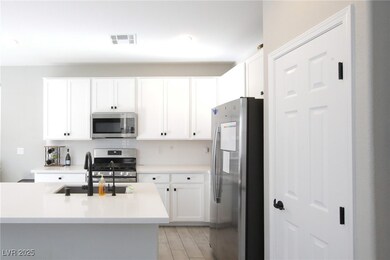 Kitchen featuring stainless steel appliances, ligh