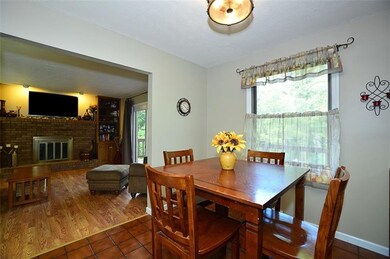 Kitchen with ceramic tile floor, new neutral wall 