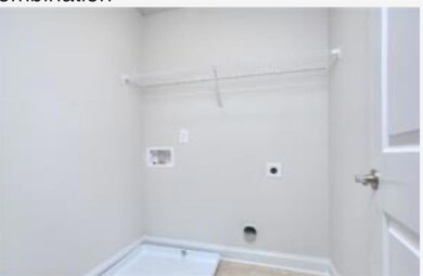 Laundry room featuring laundry area, hookup for an electric dryer, and washer hookup