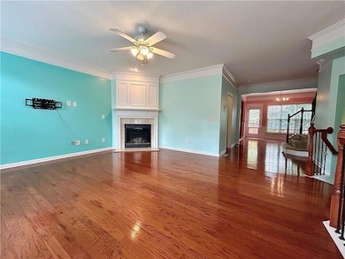 Unfurnished living room featuring ornamental moldi