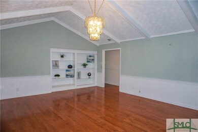 Family room with Hardwood Floors and Built-in Book