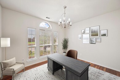 The photo has been virtually staged. Office/formal