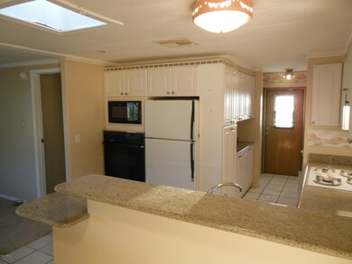 KITCHEN FROM DINING AREA