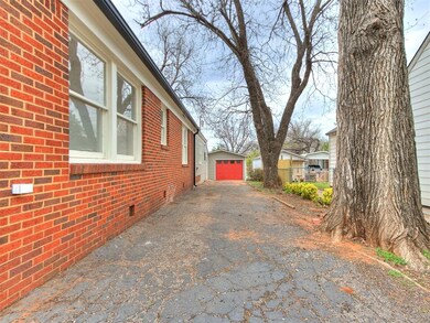 View of side of property featuring a garage
