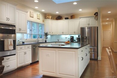 Gourmet kitchen with large island and loads of cou