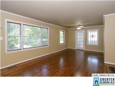 Large windows across the front with custom wood bl