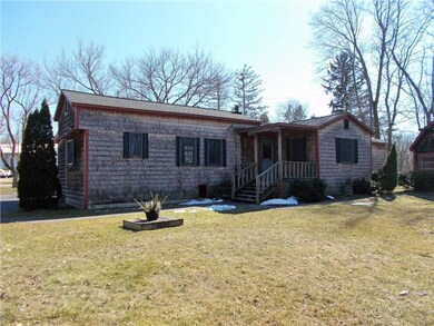 Back of home with deck porch entry