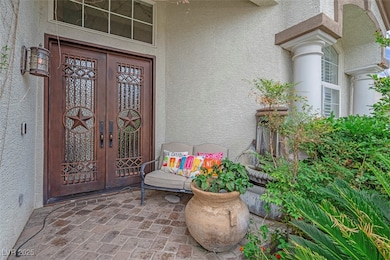 Doorway to property featuring stucco siding and fr